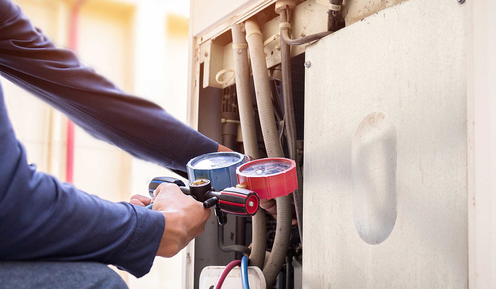 technician-hand-close-up-with-voltage-meter-doing-maintenance-at-unit-many-la