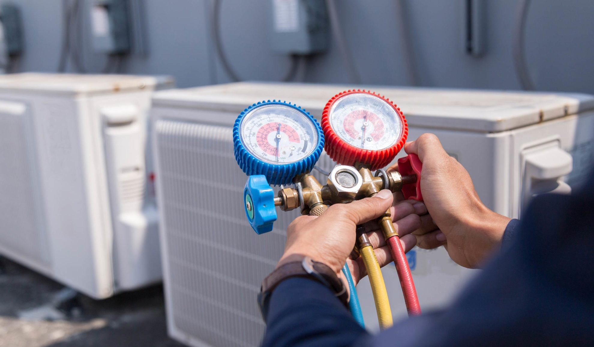 technician-hands-close-up-with-tool-repairing-hvac-units-at-property-exteriors-many-la
