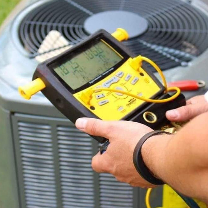 technician-hands-with-voltage-meter-doing-maintenance-to-hvac-unit-many-la