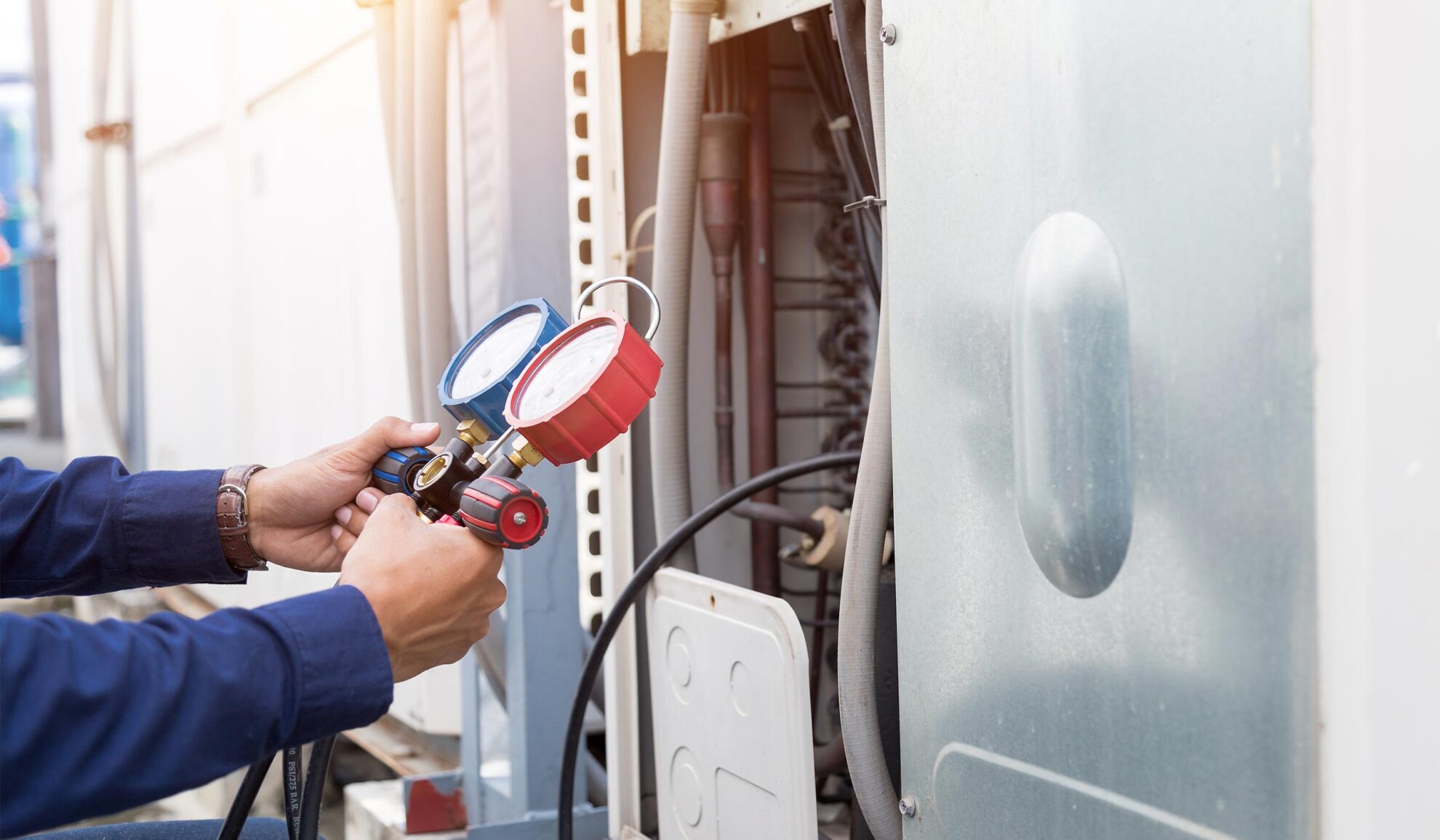 hvac-technician-doing-maintenance-at-air-conditioner-unit-close-up-many-la