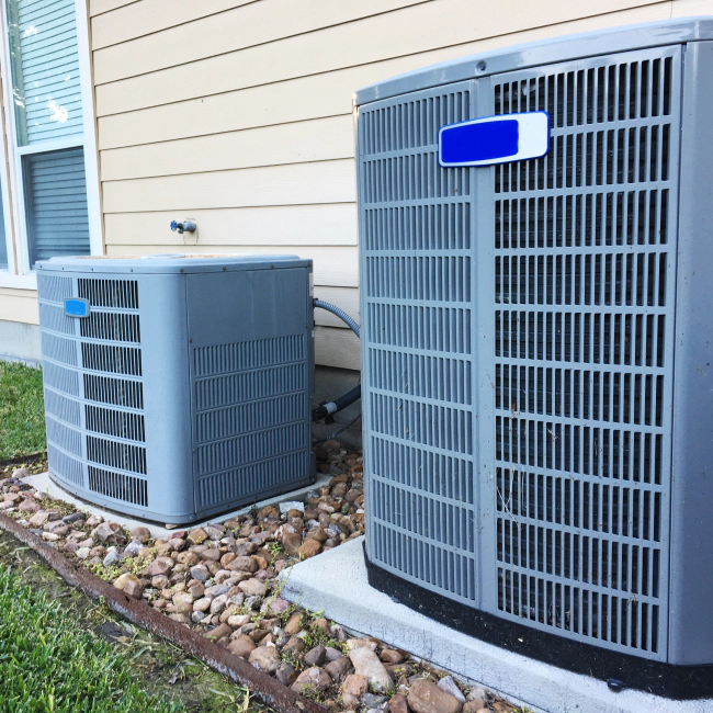 two hvac units outside home