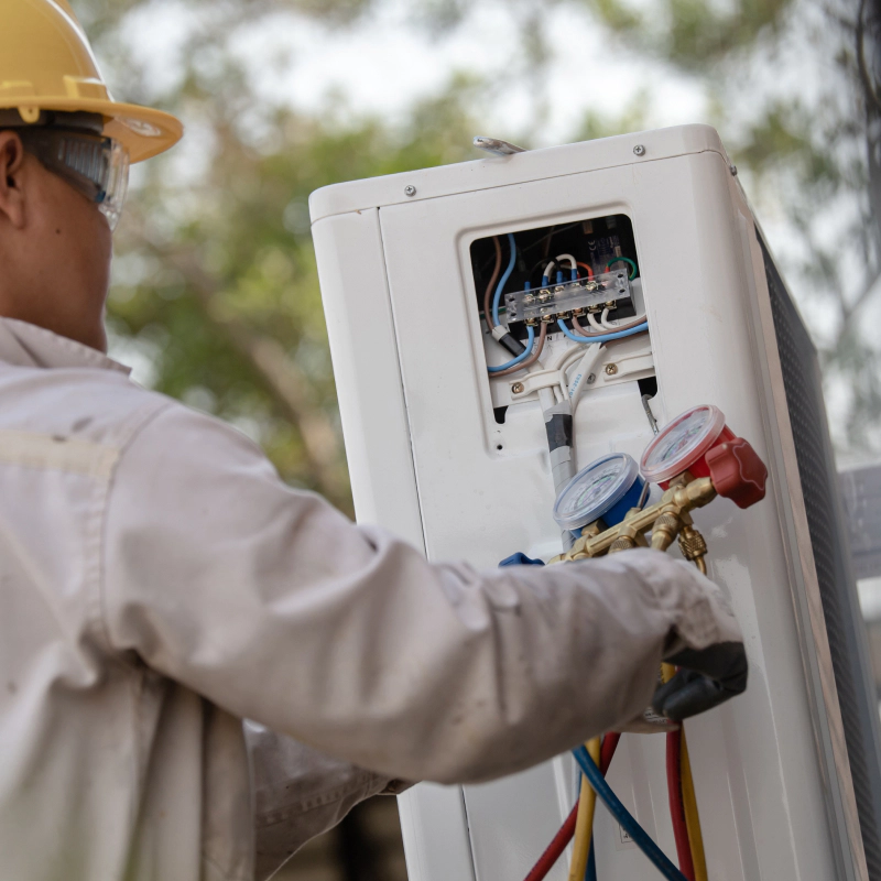 man adding freon