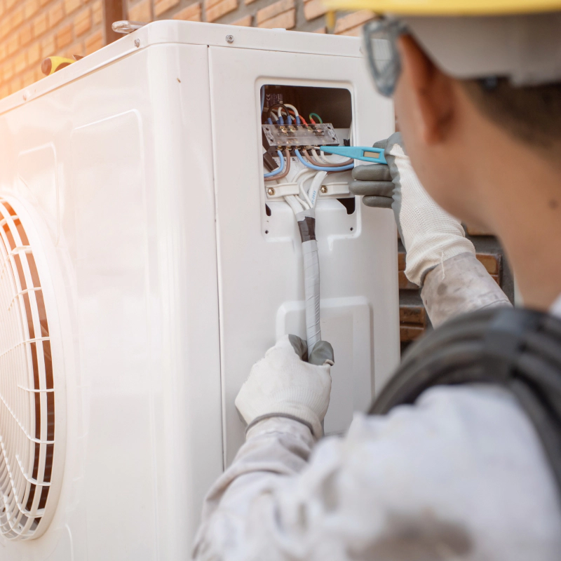 man fixing hvac wirings