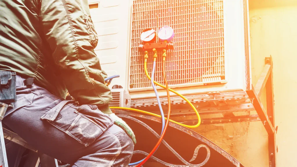 man working on hvac maintenance with complete safety gear
